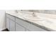 Bathroom double sink with white cabinets and granite countertops at 1926 Cobb Trl, Parrish, FL 34219