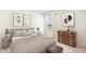 Stylishly furnished bedroom featuring a cozy bed, modern art prints, and a window with natural light at 1926 Cobb Trl, Parrish, FL 34219