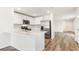 Modern kitchen with stainless steel appliances, white cabinetry, and a stylish marble countertop at 1926 Cobb Trl, Parrish, FL 34219