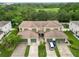 Aerial view of homes in lush neighborhood with mature trees at 2303 28Th E Ave, Palmetto, FL 34221