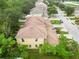 Aerial view of the home with mature trees on a tree-lined street at 2303 28Th E Ave, Palmetto, FL 34221