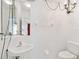 Bathroom with pedestal sink, and chandelier at 2303 28Th E Ave, Palmetto, FL 34221