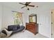 Bright bedroom with a futon, dresser, and a large window offering natural light at 2303 28Th E Ave, Palmetto, FL 34221
