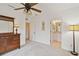 Bedroom features carpet, ceiling fan, and ensuite bathroom at 2303 28Th E Ave, Palmetto, FL 34221