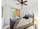Bedroom featuring a bed, window, ceiling fan and carpet at 2303 28Th E Ave, Palmetto, FL 34221