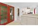 Kitchen with counter space and red doors that lead to living area with stairs at 2303 28Th E Ave, Palmetto, FL 34221