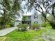 Charming two-story home featuring black shutters, well-maintained landscaping, and an attached garage at 25640 State Road 70 E, Myakka City, FL 34251