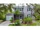 Charming two-story home with landscaped yard, garage, and inviting front porch at 25640 State Road 70 E, Myakka City, FL 34251
