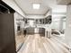 Spacious, modern kitchen with stainless steel appliances, granite countertops and hardwood flooring at 25640 State Road 70 E, Myakka City, FL 34251
