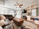 This is a living room area with built in shelves, an entertainment center, and a fireplace at 25640 State Road 70 E, Myakka City, FL 34251