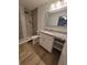 Modern bathroom featuring a tiled shower and granite vanity at 328 20Th W St, Palmetto, FL 34221