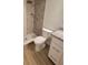 Modern bathroom featuring a tiled shower, granite vanity top, and tile flooring at 328 20Th W St, Palmetto, FL 34221