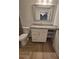 Bathroom vanity features a granite countertop, white cabinetry, and tile flooring at 328 20Th W St, Palmetto, FL 34221