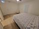 Comfortable bedroom featuring tile floors, natural light, and contemporary furnishings at 328 20Th W St, Palmetto, FL 34221