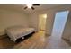 Bedroom with herringbone tile flooring and ensuite bathroom at 328 20Th W St, Palmetto, FL 34221