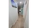 Hallway with herringbone tile flooring and white doors at 328 20Th W St, Palmetto, FL 34221