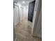Hallway with herringbone tile flooring and white doors at 328 20Th W St, Palmetto, FL 34221
