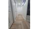 Hallway with herringbone tile flooring and white doors at 328 20Th W St, Palmetto, FL 34221
