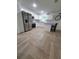 Modern kitchen featuring stainless steel appliances, white cabinetry, and a stylish center island with bar seating at 328 20Th W St, Palmetto, FL 34221