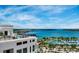 A panoramic view from atop a building overlooks a marina and bay on a bright, sunny day at 33 S Palm Ave # 1501, Sarasota, FL 34236