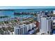 An aerial view of the marina with city buildings, sailboats, yachts, and gorgeous blue ocean waters at 33 S Palm Ave # 1501, Sarasota, FL 34236