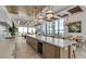 Large kitchen with a long island, pendant lighting, and floor-to-ceiling windows at 33 S Palm Ave # 1501, Sarasota, FL 34236