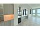 Modern kitchen with stainless steel appliances, a large island, and stunning waterfront views at 33 S Palm Ave # 1501, Sarasota, FL 34236