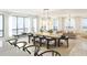 Spacious open-plan living and dining area features modern decor, large windows, and beautiful views at 33 S Palm Ave # 1501, Sarasota, FL 34236