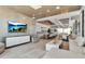 Spacious living room with a large kitchen island, floor-to-ceiling windows, and modern decor at 33 S Palm Ave # 1501, Sarasota, FL 34236