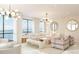 Bright and airy living room with stunning waterfront views and elegant furnishings at 33 S Palm Ave # 1501, Sarasota, FL 34236