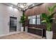 Stunning lobby with modern lighting, elevator access, wooden wall accents, and upscale finishes at 33 S Palm Ave # 1501, Sarasota, FL 34236