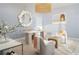 Cozy home office featuring stylish furnishings, a unique round mirror, and natural light at 33 S Palm Ave # 1501, Sarasota, FL 34236
