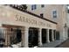 Exterior view of the Sarasota Opera House featuring elegant architecture and an inviting entrance area at 33 S Palm Ave # 1501, Sarasota, FL 34236