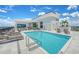 Rooftop pool with lounge chairs and views of the city skyline on a sunny day at 33 S Palm Ave # 1501, Sarasota, FL 34236