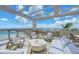 Relaxing roof deck featuring comfortable seating, an outdoor kitchen, and a beautiful view of the city at 33 S Palm Ave # 1501, Sarasota, FL 34236