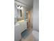 Bathroom with stackable laundry, single sink vanity and ocean themed decor at 3333 26Th E Ave # 1145, Bradenton, FL 34208