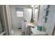Bright bathroom featuring a stackable washer and dryer and beach-themed decor at 3333 26Th E Ave # 1145, Bradenton, FL 34208