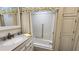 Cozy bathroom featuring a shower and tub combination with decorative curtain and ample cabinet space at 3333 26Th E Ave # 1145, Bradenton, FL 34208