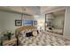 Serene bedroom featuring a seashell themed decor, bedside tables and a large mirrored closet at 3333 26Th E Ave # 1145, Bradenton, FL 34208