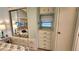 Bright bedroom with built-in drawers and a mirrored closet showcasing the bed at 3333 26Th E Ave # 1145, Bradenton, FL 34208