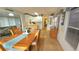 Open-concept dining area leading to a well-lit kitchen and cozy living space at 3333 26Th E Ave # 1145, Bradenton, FL 34208