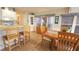 Dining room view showing seamless flow with kitchen area, and comfortable seating at kitchen bar at 3333 26Th E Ave # 1145, Bradenton, FL 34208