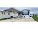 Charming mobile home featuring a covered parking and a well maintained green lawn at 3333 26Th E Ave # 1145, Bradenton, FL 34208