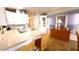 Bright kitchen with white cabinetry, modern appliances, and a cozy breakfast bar at 3333 26Th E Ave # 1145, Bradenton, FL 34208