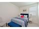 Cozy bedroom with blue accents, a comfortable queen-sized bed, and a bedside table at 3419 74Th Avenue E Cir, Sarasota, FL 34243
