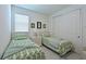 Inviting bedroom with two twin beds, a closet, and a window, perfect for children or guests at 3419 74Th Avenue E Cir, Sarasota, FL 34243