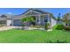 Well-maintained home boasts lush lawn, palm tree, and nicely landscaped flower beds at 3419 74Th Avenue E Cir, Sarasota, FL 34243