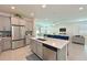 Bright kitchen with stainless steel appliances, granite counters and center island, great for entertaining at 3419 74Th Avenue E Cir, Sarasota, FL 34243