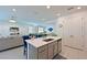 Lovely kitchen with island including a sink, dishwasher and seating adjacent to the open floor plan at 3419 74Th Avenue E Cir, Sarasota, FL 34243