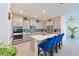 Well-equipped kitchen featuring stainless steel appliances, quartz countertops, and gray cabinetry at 3419 74Th Avenue E Cir, Sarasota, FL 34243